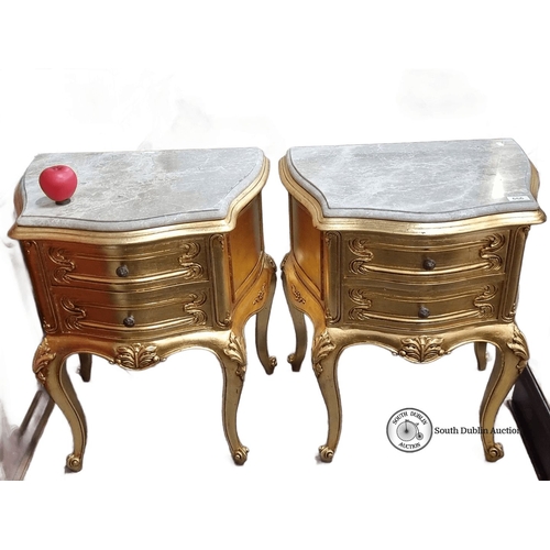 666 - Star Lot : A fabulous pair of ornate gilded side tables with cold Italian marble tops, featuring cab... 