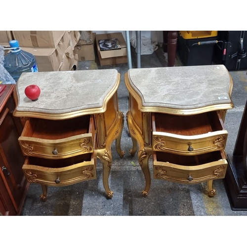 666 - Star Lot : A fabulous pair of ornate gilded side tables with cold Italian marble tops, featuring cab... 