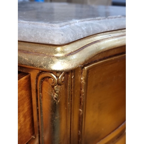 666 - Star Lot : A fabulous pair of ornate gilded side tables with cold Italian marble tops, featuring cab... 