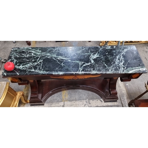 667 - Star Lot : A large mahogany console table with black cold Itialin marble top, featuring inlaid decor... 