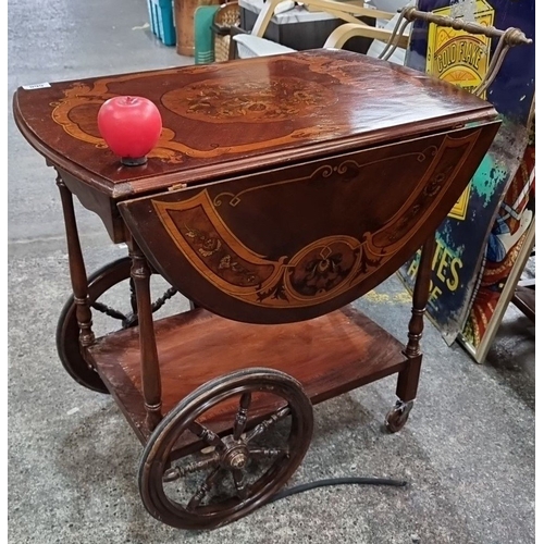 668 - Star lot Antique style mahogany inlaid trolley with ornamental wheels and drop-leaf sides. Approxima... 