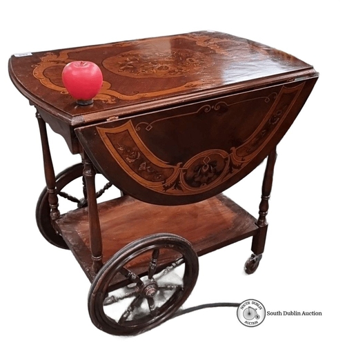 668 - Star lot Antique style mahogany inlaid trolley with ornamental wheels and drop-leaf sides. Approxima... 