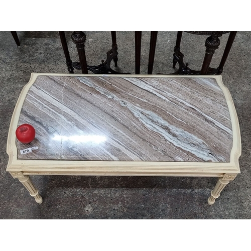 670 - Star lot : A cold Italian Marble-topped wooden coffee table with carved legs and decorative floral a... 