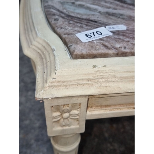 670 - Star lot : A cold Italian Marble-topped wooden coffee table with carved legs and decorative floral a... 