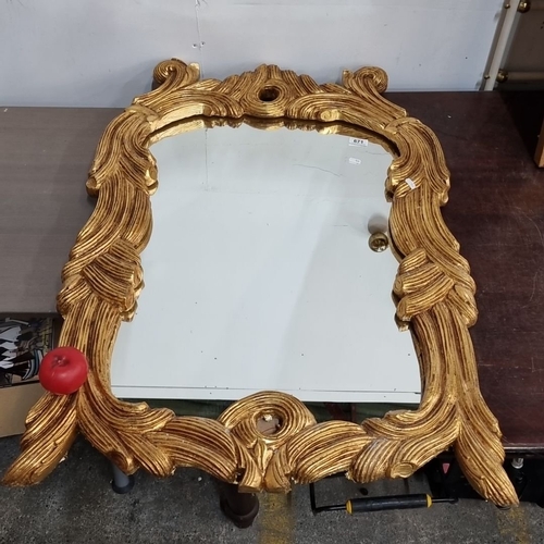 671 - Star Lot : A stunning Ornate gilt wood mirror, Baroque style, approximately 70x100 cm. Intricately c... 