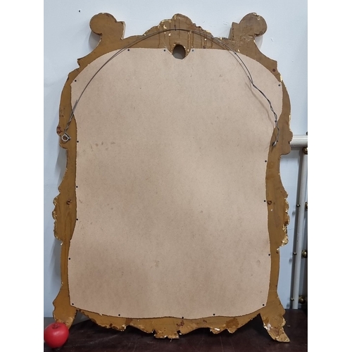 671 - Star Lot : A stunning Ornate gilt wood mirror, Baroque style, approximately 70x100 cm. Intricately c... 