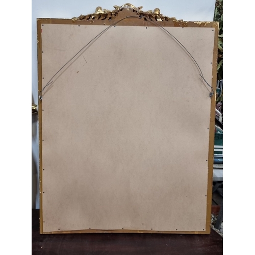 672 - Star Lot : A very impressive Giltwood mirror with ornate floral and scroll detailing. Approximately ... 