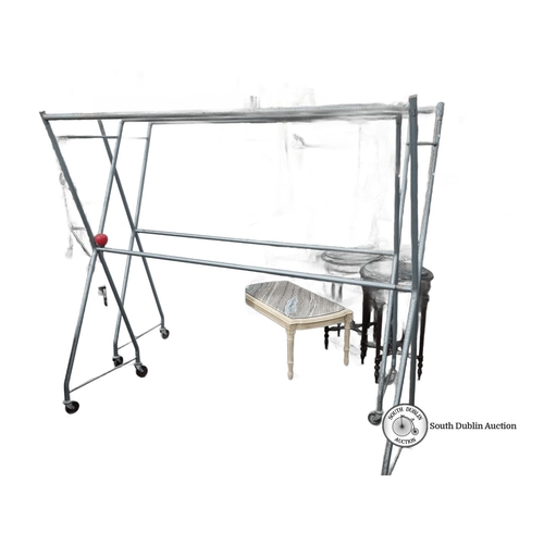 674 - Two very large vintage metal rolling garment rack with an angular frame. Approximately 180 cm high, ... 