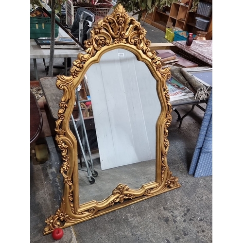 675 - Ornate Baroque-style gilded mirror with intricately carved floral motifs. Approximately 150 cm tall,... 