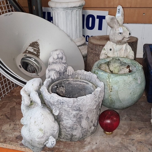 864 - Collection of garden ornaments: rabbit and animal-themed planters, assorted sizes. Includes vintage-... 