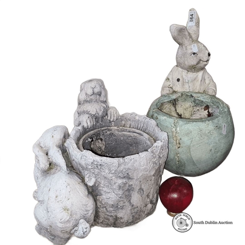 864 - Collection of garden ornaments: rabbit and animal-themed planters, assorted sizes. Includes vintage-... 