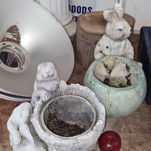 864 - Collection of garden ornaments: rabbit and animal-themed planters, assorted sizes. Includes vintage-... 