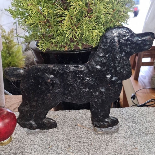 865 - Cast iron poodle doorstop on granite base. Approximately 12 inches long, 6 inches high. This is a gr... 