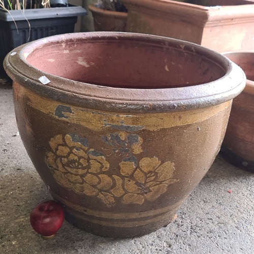 879 - Large ceramic planter with floral decoration in brown and gold tones. Approximately 45 cm in diamete... 