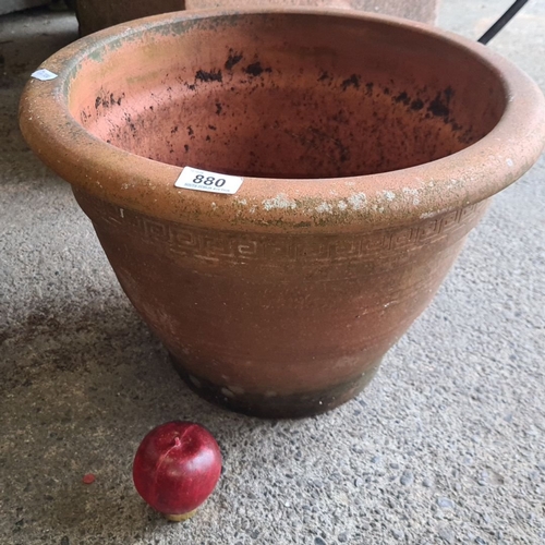 880 - Terracotta garden planter with a Greek key design. Approximately 50 cm in diameter and 40 cm in heig... 