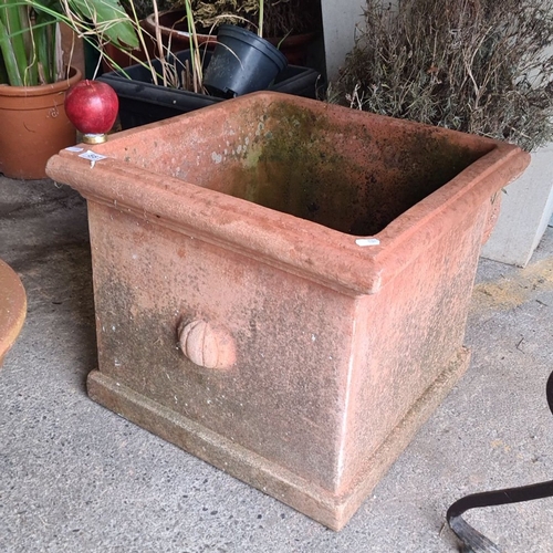 881 - A large Terracotta square planter with decorative detailing. Approximately 18 inches in height, 20 i... 