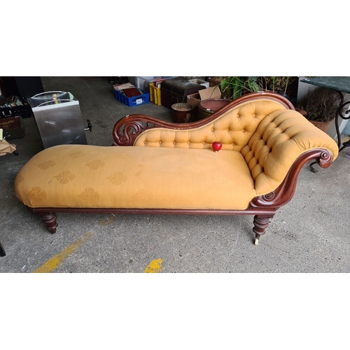 884 - Victorian chaise longue with carved mahogany frame and mustard upholstery. It features a tufted back... 