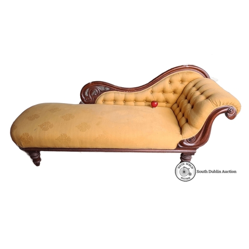 884 - Victorian chaise longue with carved mahogany frame and mustard upholstery. It features a tufted back... 