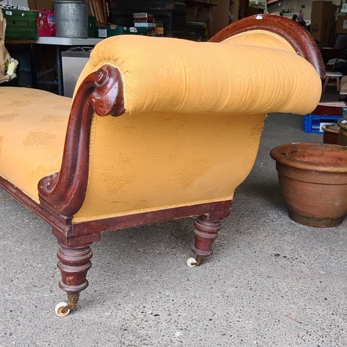 884 - Victorian chaise longue with carved mahogany frame and mustard upholstery. It features a tufted back... 