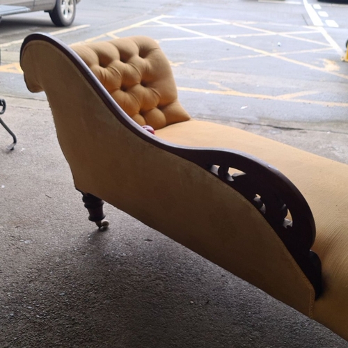 884 - Victorian chaise longue with carved mahogany frame and mustard upholstery. It features a tufted back... 