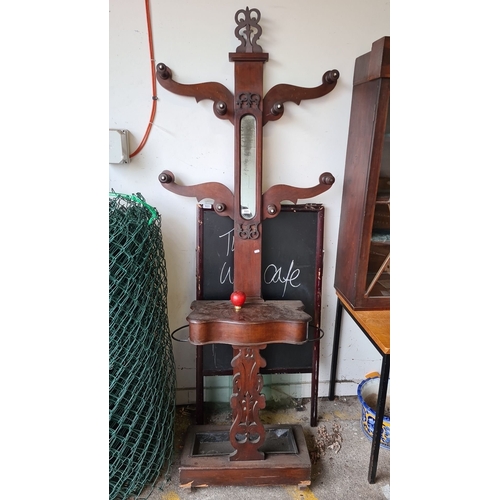 885 - Victorian mahogany hall tree with mirror and storage compartment. Features ornate scrollwork and hoo... 