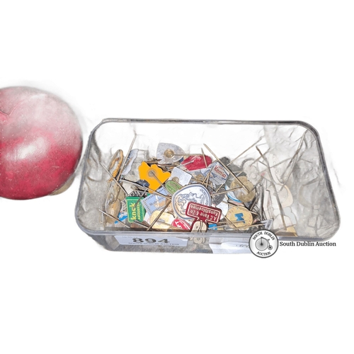 894 - Collection of assorted vintage lapel pins in a clear plastic container. Various designs and brands, ... 