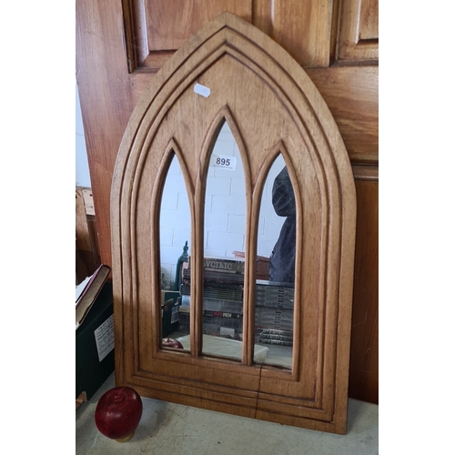 895 - Gothic Revival-style wooden mirror with arched design. Approximately 70 cm high.