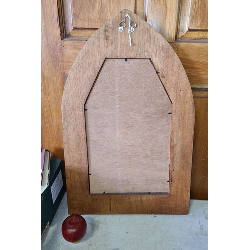 895 - Gothic Revival-style wooden mirror with arched design. Approximately 70 cm high.