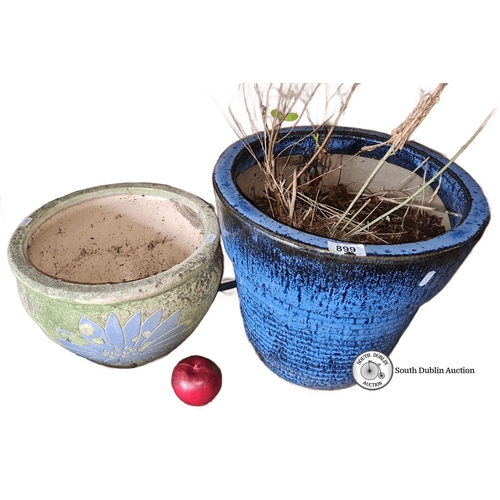 899 - Pair of ceramic garden pots. One has a green base with a blue floral design, the other is in a textu... 