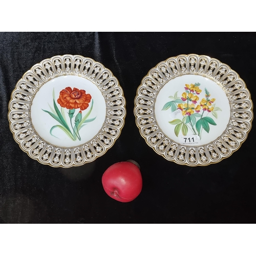 711 - Two very pretty hand painted side plates featuring gilt gold tone pierced rim detail along with flor... 