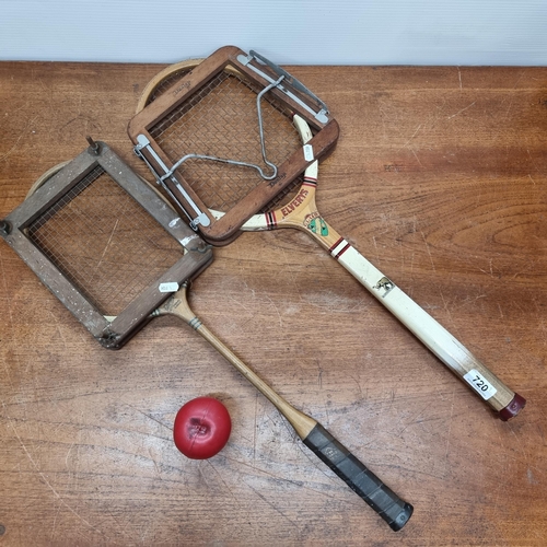 720 - Two pieces of vintage sporting equipment including a Dunlop tennis racket and a badminton racket. Bo... 