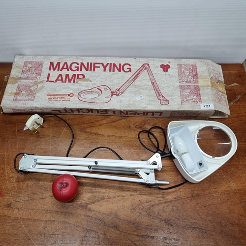 721 - A Dutch made magnifying lamp complete in original box, ideal for reading or crafts.