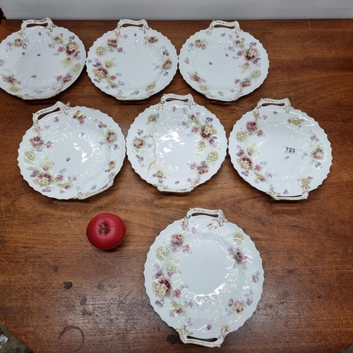 723 - A beautiful selection of seven Victorian hand painted serving plates boasting rich floral tones and ... 