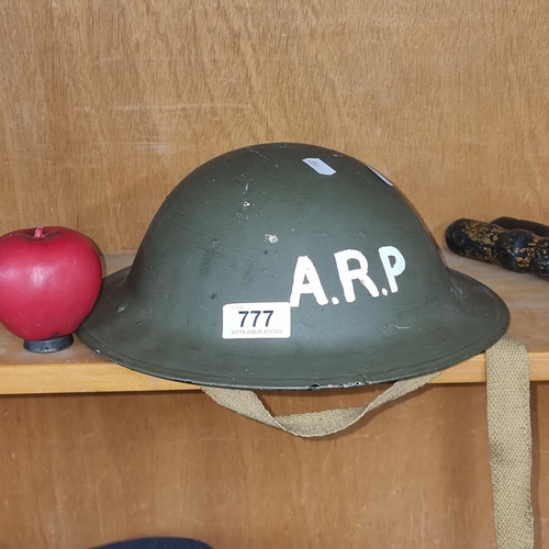 777 - A fantastic WW2 Air Raid Precaution brodie helmet. Comes with original liner and helmet strap.