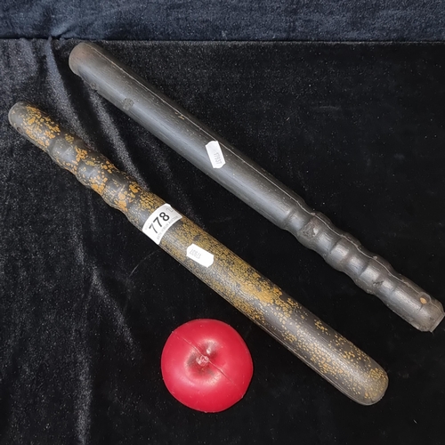 778 - Two vintage genuine policemen's foam and metal batons. They are foamy but if you got a smack it woul... 