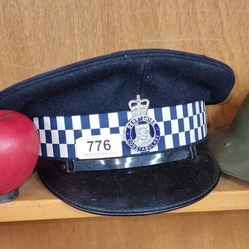 776 - A post 1953 Derbyshire Constabulary cap in good condition. Complete with chromed metal cap badge and... 