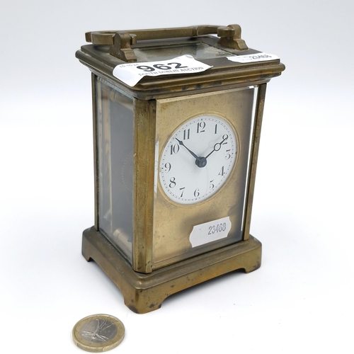 962 - An antique mechanical carriage clock, good example with glass sides and top and original key.