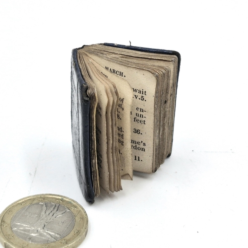 965 - A miniature just over an inch leather bound book with dialy religious versus. No date but would say,... 