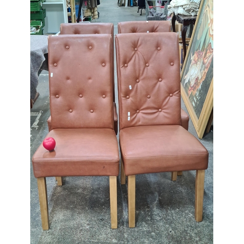 1073 - A set of four comfortable high back dining chairs with padded button back seats.
Previous in auction... 