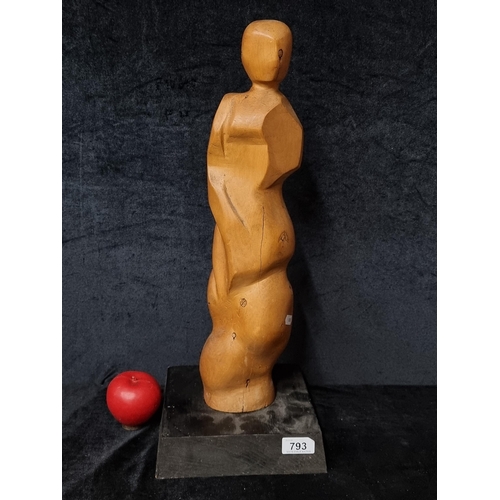 1171 - A tall hand carved wooden sculpture of an abstracted figure form. Mounted on a black painted wooden ... 