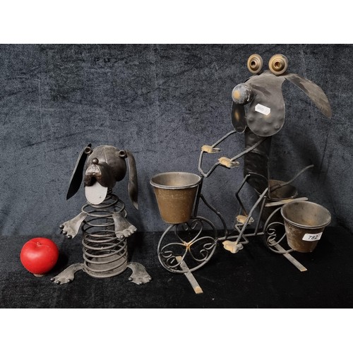 1173 - Two charming Metal Garden figures. Includes a Planter and slinky in dog form.
Previous in auction on... 