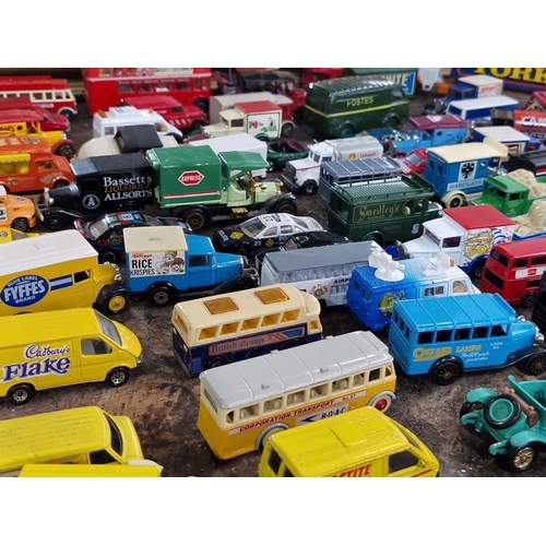 921 - Collection of approximately 65 vintage die-cast model vehicles, featuring iconic brands like Cadbury... 