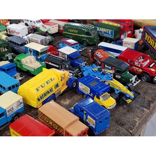 921 - Collection of approximately 65 vintage die-cast model vehicles, featuring iconic brands like Cadbury... 