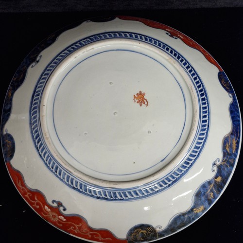 109 - Star lot : A superb example of an antique large Japanese Imari charger plate featuring the classic o... 