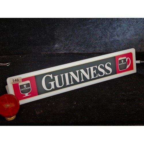 146 - A Guinness branded advertising plug n shelf light.