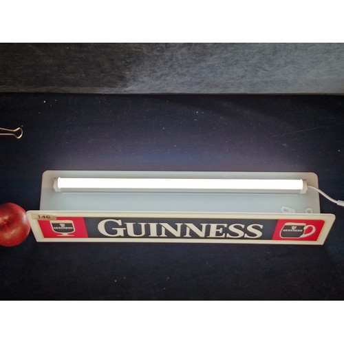 146 - A Guinness branded advertising plug n shelf light.