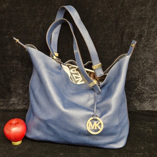 150 - A stylish ladies designer Michael Kors handbag.