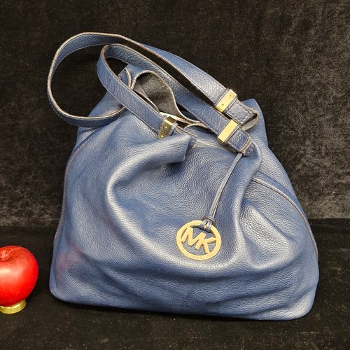 150 - A stylish ladies designer Michael Kors handbag.