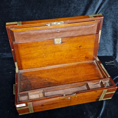 207 - A large Mahogany antique writing slope with brass hardware and additional compartments for stationar... 