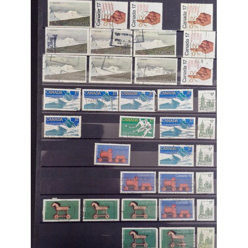 242 - Four stamp collector albums. Includes three A4 examples which are full of AU unmounted Canadian, New... 